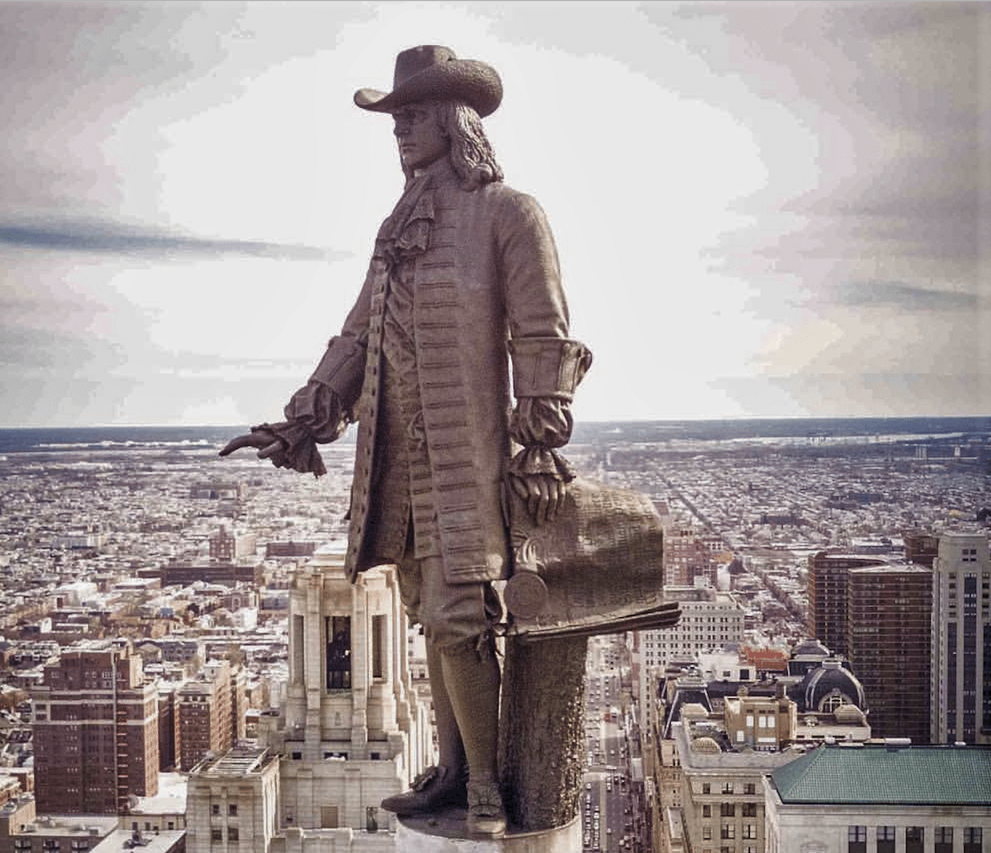 Statue of William Penn looking down on modern Philadelphia